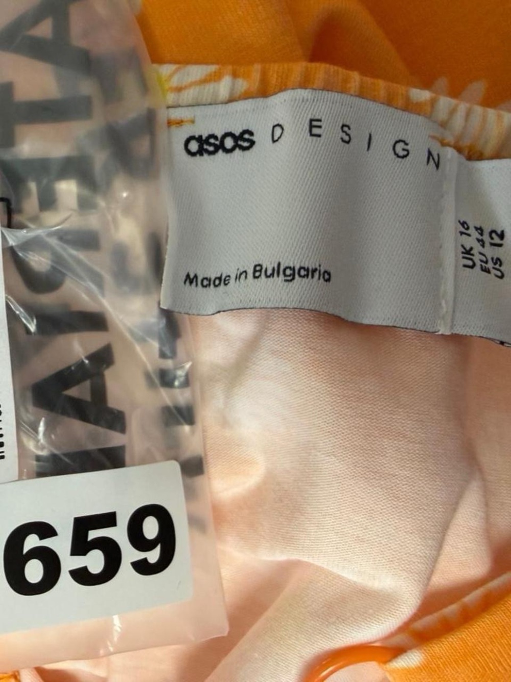 ASOS DESIGN Mini Sundress With Bow font detail in Orange Daisy print - Picture 4 of 5